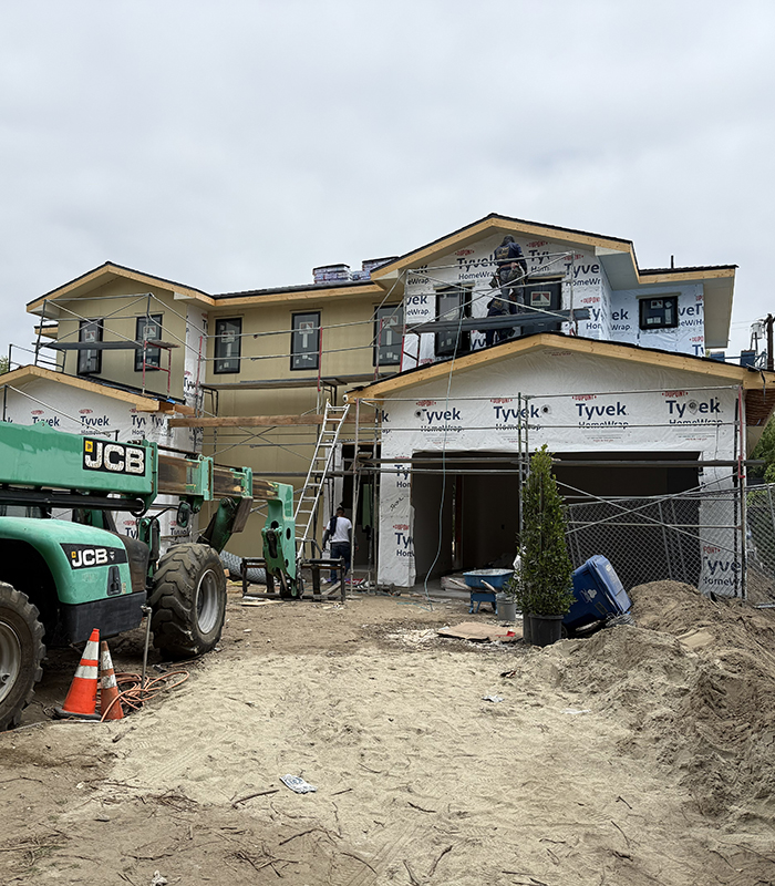 AAAR Builders team reviewing architectural plans in Los Angeles office